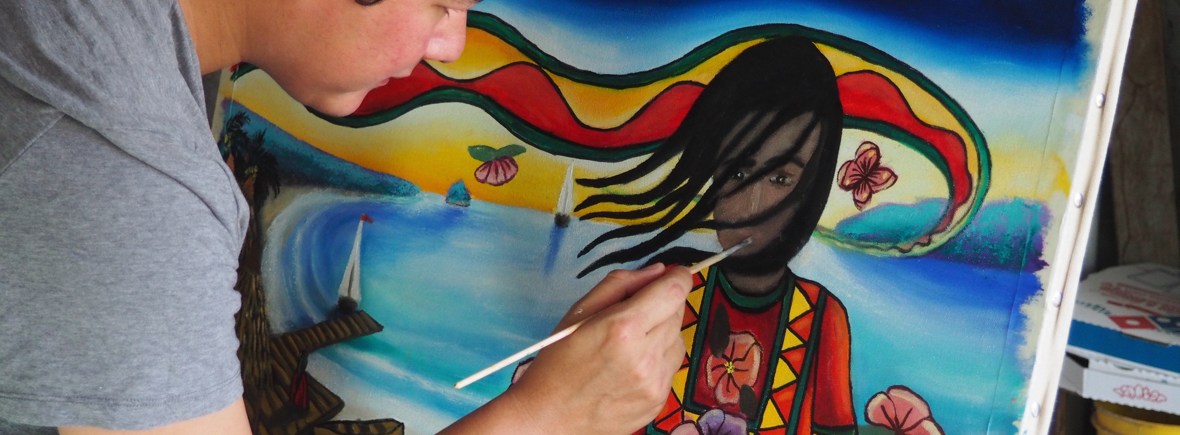 Image of Efraín painting La Niña del Tropico